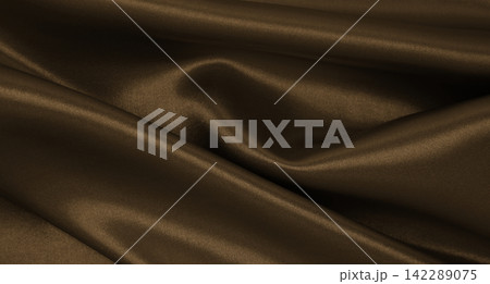 Smooth elegant brown silk or satin luxury cloth texture as abstract background. Luxurious background design.  In Sepia toned. Retro style 142289075