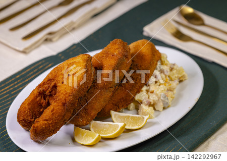 Traditional Christmas dinner in Czech Republic - fried carp with potato salad 142292967