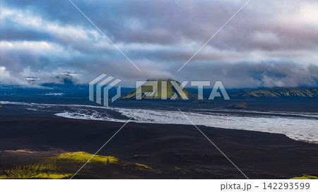 Black sand beach with moss-covered mountain and coastal breakers Black sand beach with moss-covered mountain and coastal breakers 142293599