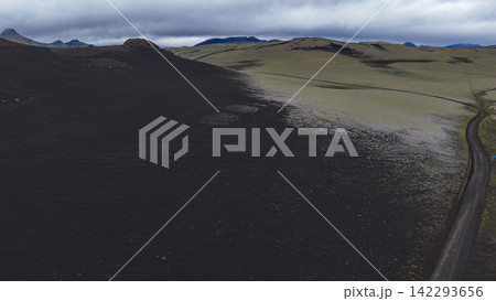 Aerial view of volcanic landscape with lava field and road, Skaft?rhreppur Iceland 142293656