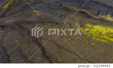 Aerial view of lava field with moss coverage and yellow lichen, Skaft?rhreppur Iceland Aerial view of lava field with moss coverage and yellow lichen, Skaft?rhreppur Iceland 142294443