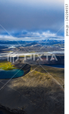 Aerial view of volcanic crater with turquoise crater lake and glacial valleys, ytra Iceland 142294557