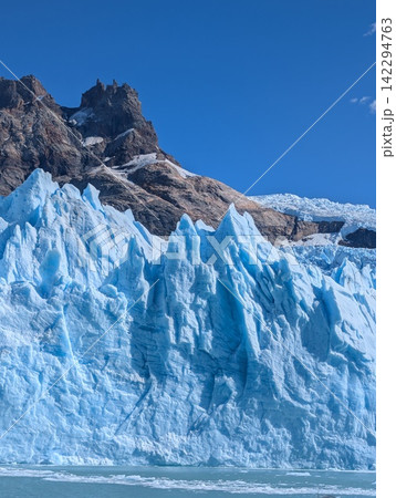 Vertical View of Jagged Blue Ice Seracs at Spegazzini Glacier Vertical View of Jagged Blue Ice Seracs at Spegazzini Glacier 142294763