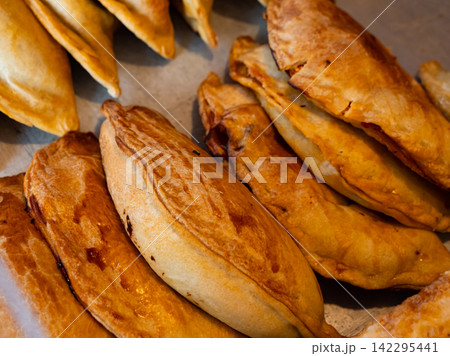 Baked snack empanada at market Baked snack empanada at market 142295441