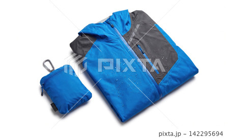 Waterproof blue and grey hooded jacket with compact carrying pouch windbreaker waterproof droplets packable lightweight clothing outerwear equipment adventure portable isolated background Waterproof blue and grey hooded jacket with compact carrying pouch windbreaker waterproof droplets packable lightweight clothing outerwear equipment adventure portable isolated background 142295694
