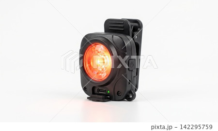 Compact black safety running light with glowing red led flashing visibility athletic exercise training electronic portable wearable accessory isolated background illumination Compact black safety running light with glowing red led flashing visibility athletic exercise training electronic portable wearable accessory isolated background illumination 142295759