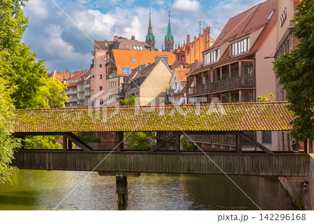 Covered Wooden Bridge over Pegnitz River in Nuremberg, Germany Covered Wooden Bridge over Pegnitz River in Nuremberg, Germany 142296168
