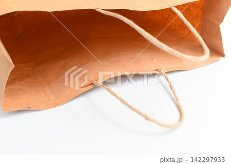 brown paper bag isolated on white background, recycle material brown paper bag isolated on white background, recycle material 142297933