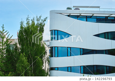 Contemporary Office Building with Curved Glass Facade Contemporary Office Building with Curved Glass Facade 142298793