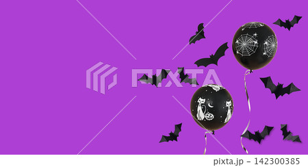 Halloween. Balloons featuring spooky designs float against vibrant purple background Halloween. Balloons featuring spooky designs float against vibrant purple background 142300385