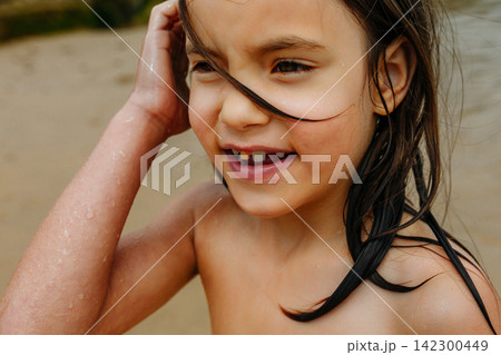 Candid Portrait of Happy Child After Swimming in the Sea Candid Portrait of Happy Child After Swimming in the Sea 142300449