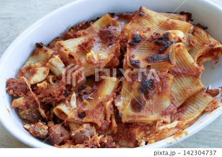 Baked pasta dish with cheese tomato sauce 142304737