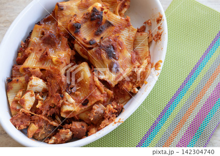 Baked pasta dish with cheese tomato sauce 142304740