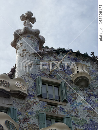 Exterior view of Casa Batllo by Antoni Gaudi in Barcelona Spain showing its colorful modernist facade and distinctive architectural details 142306171