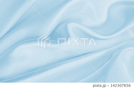 Smooth elegant blue silk or satin luxury cloth texture as abstract background. Luxurious background design Smooth elegant blue silk or satin luxury cloth texture as abstract background. Luxurious background design 142307656