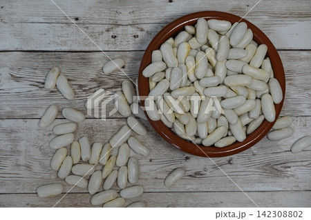 Fabada beans showing a healthy staple food, ingredient for hearty stews, and a symbol of traditional spanish cooking Fabada beans showing a healthy staple food, ingredient for hearty stews, and a symbol of traditional spanish cooking 142308802