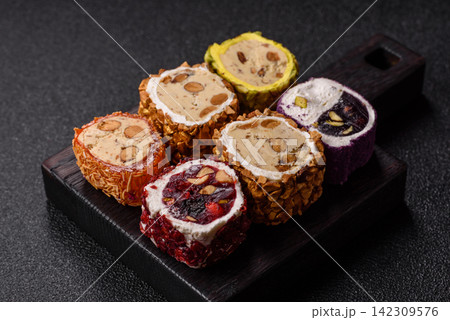 Turkish delight or lokum is a traditional Eastern sweet made with nuts. Turkish delight, lokum Turkish delight or lokum is a traditional Eastern sweet made with nuts. Turkish delight, lokum 142309576