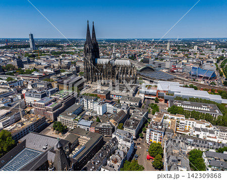 High angle wide horizontal aerial drone photograph of Cologne Cathedral, central railway station, urban cityscape, and surrounding architecture in Cologne, North Rhine-Westphalia, Germany on sunny day High angle wide horizontal aerial drone photograph of Cologne Cathedral, central railway station, urban cityscape, and surrounding architecture in Cologne, North Rhine-Westphalia, Germany on sunny day 142309868