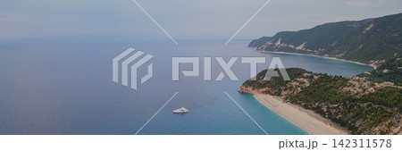 Aerial panoramic view of Kathisma beach coastline with turquoise water white yacht green hills and steep cliffs in Lefkada Greece horizontal stock photo Aerial panoramic view of Kathisma beach coastline with turquoise water white yacht green hills and steep cliffs in Lefkada Greece horizontal stock photo 142311578