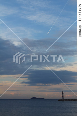 Seascape at sunshine. Lighthouse and sailings on the coast. Seaside town of Turgutreis and spectacular sunshine Seascape at sunshine. Lighthouse and sailings on the coast. Seaside town of Turgutreis and spectacular sunshine 142314519