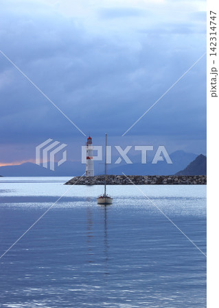 Seascape at sunshine. Lighthouse and sailings on the coast. Seaside town of Turgutreis and spectacular sunshine 142314747