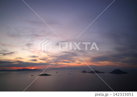 Seaside town of Turgutreis and spectacular sunsets. Bodrum, Turkey. sunset aerial drone photo 142315051