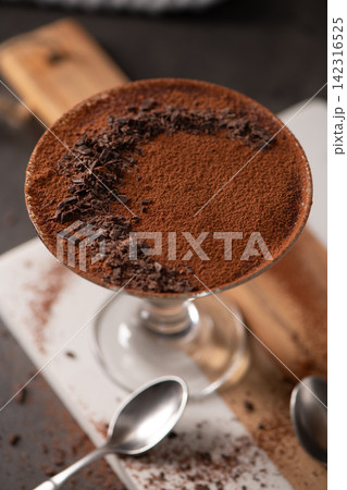 Top View of Chocolate Mousse Dessert in Glass with Cocoa Powder and Shaved Chocolate 142316525