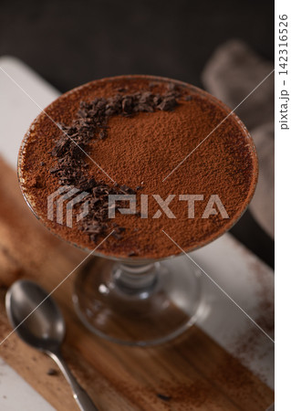 Top Down View of Tiramisu Dessert in a Glass with Cocoa Powder and Chocolate Shavings Top Down View of Tiramisu Dessert in a Glass with Cocoa Powder and Chocolate Shavings 142316526
