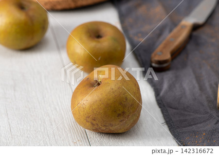 Preparation scene with a rustic apple 142316672
