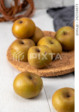 Still life of rustic green apples 142316673