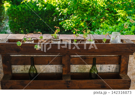 Rustic Mediterranean planter with succulents on traditional countryside terrace 142316873