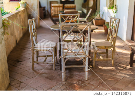 Rustic Mediterranean terrace dining area in historic countryside residence Rustic Mediterranean terrace dining area in historic countryside residence 142316875