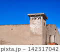 Building facade with electrical insulators under blue sky 142317042