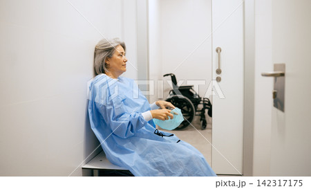 Senior patient waiting for medical procedure in hospital Senior patient waiting for medical procedure in hospital 142317175