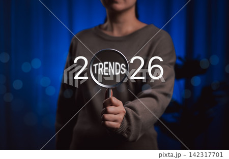 2026 Business Trends Concept. A hand holds magnifying glass focusing on the word Trends within the year 2026, representing the concept of future business and marketing trends and seo planning. 2026 Business Trends Concept. A hand holds magnifying glass focusing on the word Trends within the year 2026, representing the concept of future business and marketing trends and seo planning. 142317701