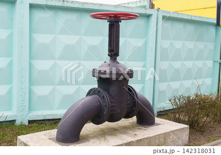 Black Fire Hydrant on Cement Block 142318031