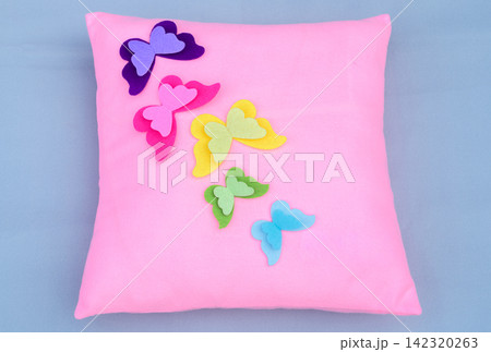 Pink decorative pillow with colorful handmade felt butterfly appliques Pink decorative pillow with colorful handmade felt butterfly appliques 142320263