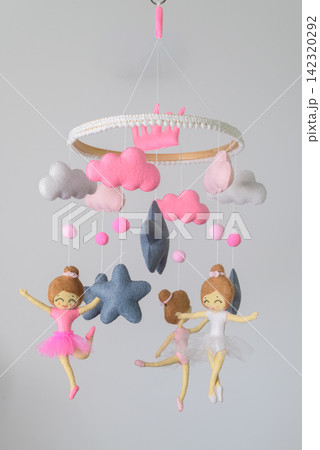 A charming handmade nursery cot mobile with pink and blue ballerina dolls, fluffy clouds, stars, moons, and soft hanging decorations A charming handmade nursery cot mobile with pink and blue ballerina dolls, fluffy clouds, stars, moons, and soft hanging decorations 142320292