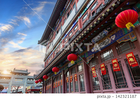 classical Chinese wooden architectural building with traditional tile roof under blue sky classical Chinese wooden architectural building with traditional tile roof under blue sky 142321187