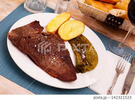 Grilled beef entrecote with potatoes and baked jalapenos Grilled beef entrecote with potatoes and baked jalapenos 142321523