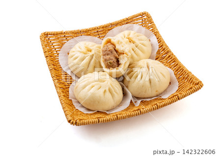 traditional Tianjin style steamed pork stuffed buns served on basket 142322606