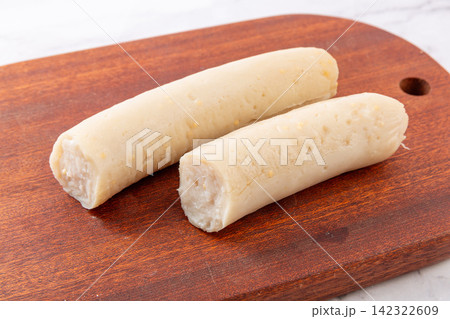 cooked flying fish roe chicken sausages on wooden cutting board 142322609