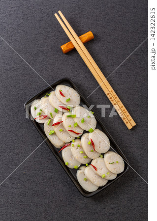 cooked flying fish roe chicken sausages on wooden cutting board 142322615