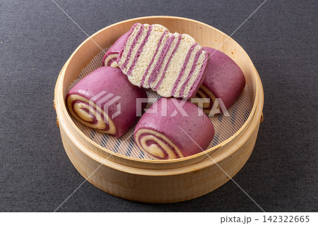 layered purple sweet potato swirl steamed buns huajuan in woven basket layered purple sweet potato swirl steamed buns huajuan in woven basket 142322665