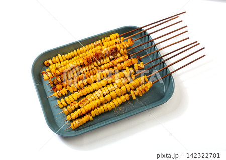 asian style grilled sweet corn skewers seasoned with spices on tray asian style grilled sweet corn skewers seasoned with spices on tray 142322701