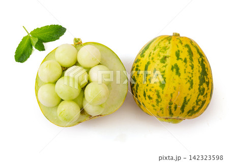 whole and Cut Striped Oriental Melon whole and Cut Striped Oriental Melon 142323598