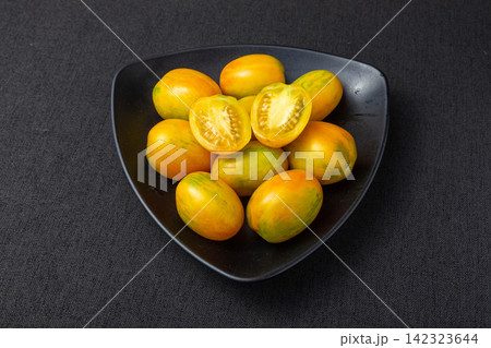 whole and Cut Tiger Stripe Tomatoes 142323644