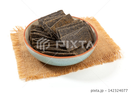 heap of Black Sesame Grain Crispy Rice Crackers 142324077