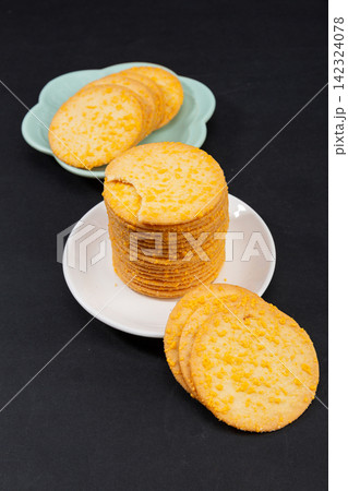 stack of Thin Crispy Potato Egg Yolk Biscuits 142324078