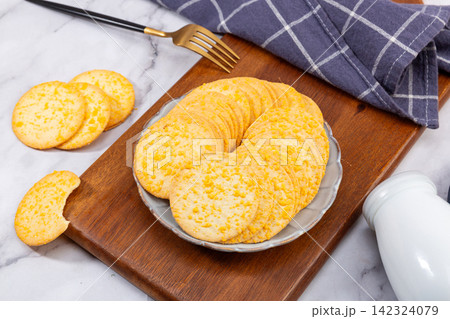 stack of Thin Crispy Potato Egg Yolk Biscuits 142324079